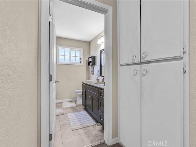 10316 S San Pedro St, Los Angeles, CA 90003 - bathroom with vanity, a closet, and tile patterned flooring