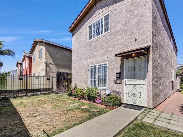 10316 S San Pedro St, Los Angeles, CA 90003 - view of front of property featuring stucco siding