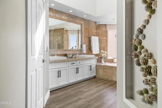 1758 Emerald Isle Way, Oxnard, CA 93035 - full bath featuring double vanity, a garden tub, wood finished floors, a shower with door, and recessed lighting