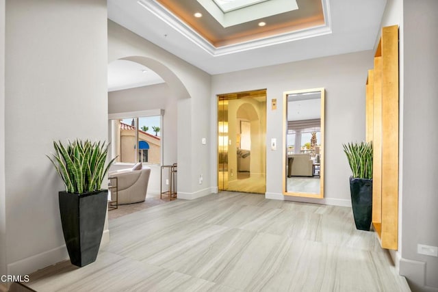 1758 Emerald Isle Way, Oxnard, CA 93035 - foyer entrance with a tray ceiling, healthy amount of natural light, a skylight, arched walkways, and recessed lighting