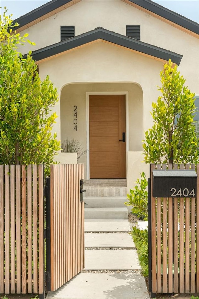 2404 Glover Pl, Los Angeles, CA 90031 - doorway to property featuring stucco siding and a gate