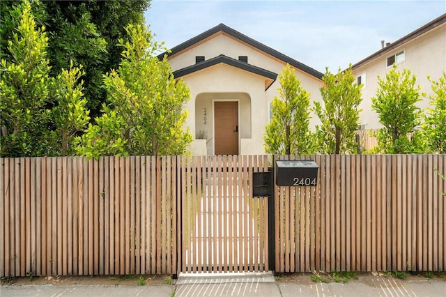 2404 Glover Pl, Los Angeles, CA 90031 - view of front of house featuring stucco siding and a gate