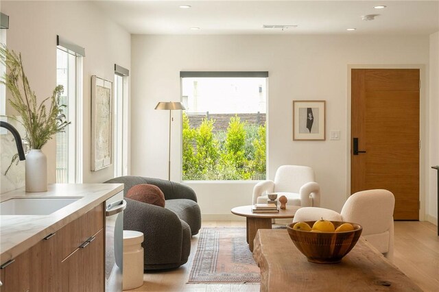 2404 Glover Pl, Los Angeles, CA 90031 - sitting room featuring healthy amount of natural light, light wood finished floors, and recessed lighting
