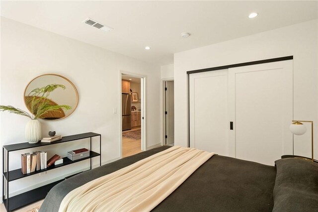 2404 Glover Pl, Los Angeles, CA 90031 - bedroom featuring freestanding refrigerator, recessed lighting, and a closet