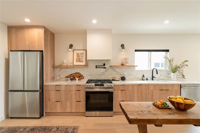 2404 Glover Pl, Los Angeles, CA 90031 - kitchen with stainless steel appliances, modern cabinets, light wood finished floors, light countertops, and recessed lighting