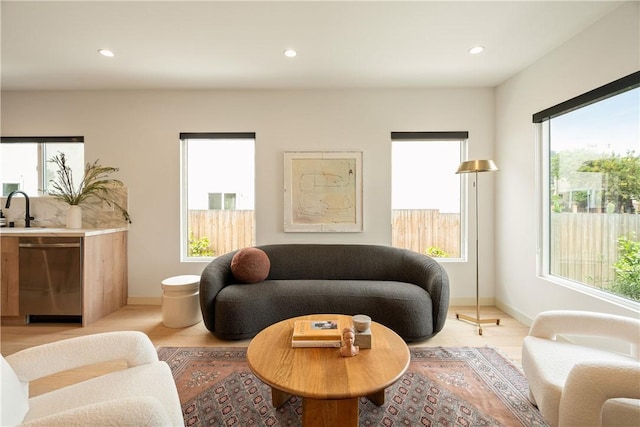 2404 Glover Pl, Los Angeles, CA 90031 - living area featuring light wood finished floors, plenty of natural light, and recessed lighting