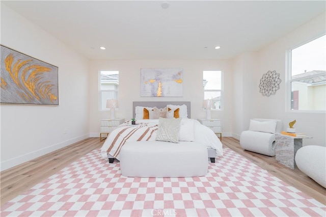 11237 Gladhill Rd Unit 12, Whittier, CA 90604 - bedroom featuring light wood finished floors, multiple windows, and recessed lighting