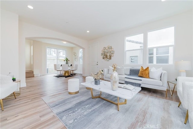 11237 Gladhill Rd Unit 12, Whittier, CA 90604 - living room with arched walkways, light wood-type flooring, and recessed lighting