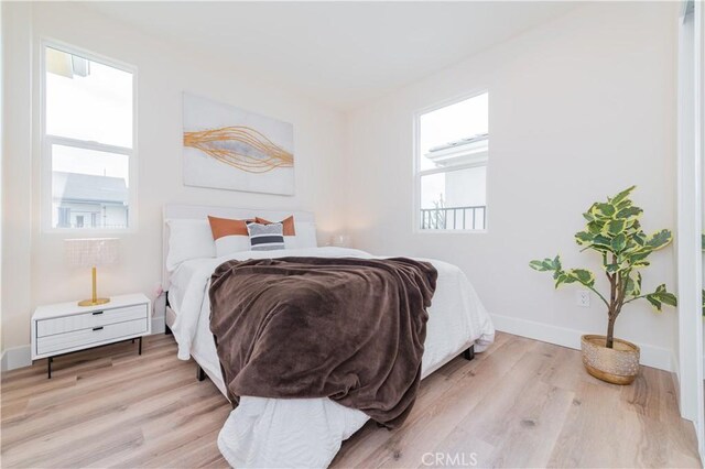11237 Gladhill Rd Unit 12, Whittier, CA 90604 - bedroom featuring light wood-type flooring and baseboards