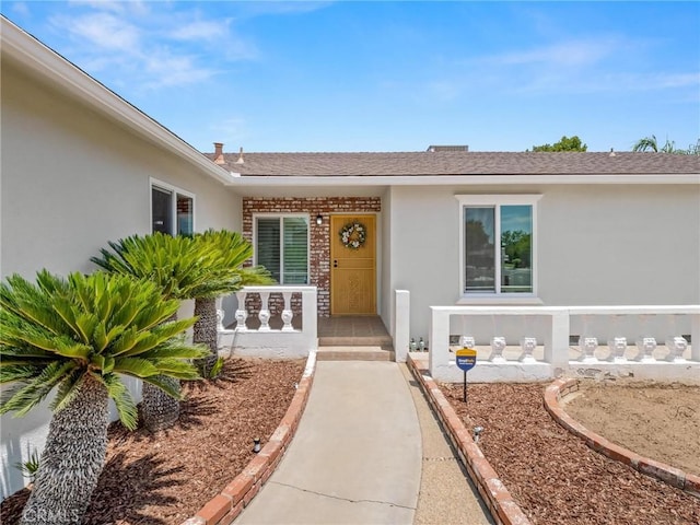 1263 Bundy Ave, Clovis, CA 93611 - entrance to property featuring stucco siding, covered porch, and a shingled roof