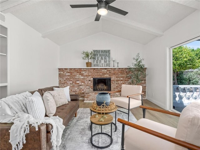 1263 Bundy Ave, Clovis, CA 93611 - living room with wood finished floors, a ceiling fan, and a fireplace