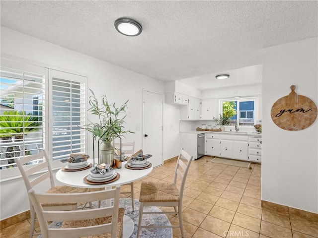 1263 Bundy Ave, Clovis, CA 93611 - dining room with light tile patterned flooring and a textured ceiling