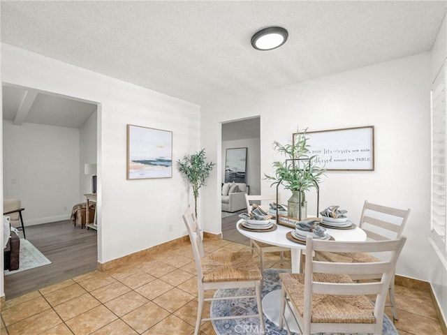 1263 Bundy Ave, Clovis, CA 93611 - dining room featuring a textured ceiling and baseboards