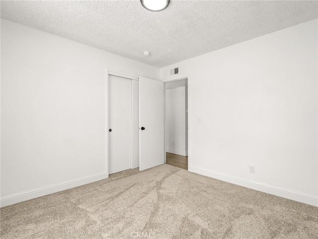 1263 Bundy Ave, Clovis, CA 93611 - unfurnished bedroom with carpet, a closet, and a textured ceiling