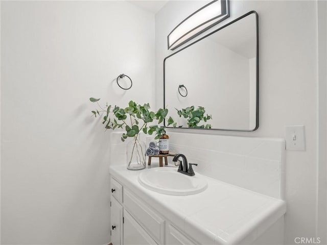 1263 Bundy Ave, Clovis, CA 93611 - bathroom with vanity and decorative backsplash