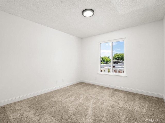 1263 Bundy Ave, Clovis, CA 93611 - carpeted empty room featuring baseboards and a textured ceiling