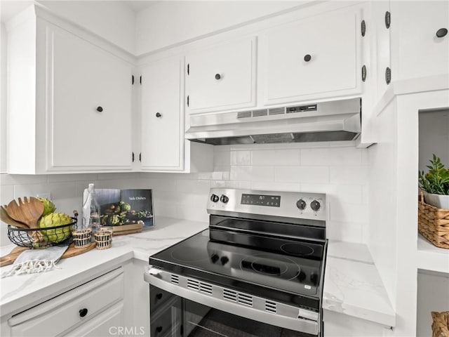 1263 Bundy Ave, Clovis, CA 93611 - kitchen with stainless steel range with electric cooktop, extractor fan, white cabinetry, and decorative backsplash