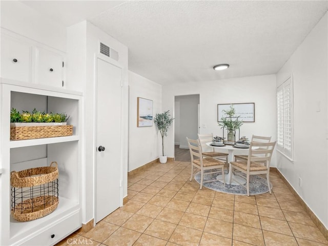 1263 Bundy Ave, Clovis, CA 93611 - dining room featuring light tile patterned floors and baseboards