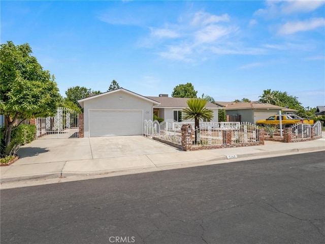 1263 Bundy Ave, Clovis, CA 93611 - ranch-style house featuring a fenced front yard, a garage, concrete driveway, and stucco siding