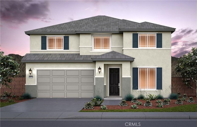 4248 Ladrillo St, Lake Elsinore, CA 92530 - view of front of house with stucco siding, driveway, and a garage