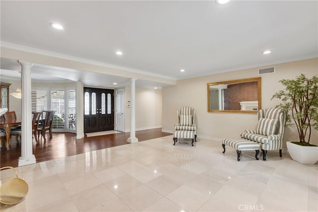 6636 Wooster Ave, Los Angeles, CA 90056 - tiled entryway featuring decorative columns, recessed lighting, and crown molding