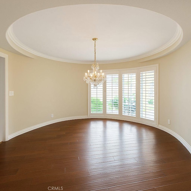 6636 Wooster Ave, Los Angeles, CA 90056 - spare room with a chandelier, dark wood-type flooring, and ornamental molding