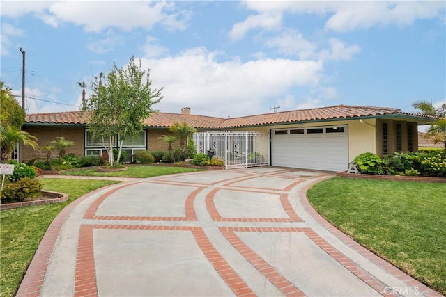 6636 Wooster Ave, Los Angeles, CA 90056 - ranch-style house featuring a tiled roof, concrete driveway, and a garage