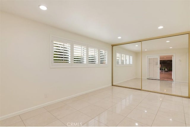 6636 Wooster Ave, Los Angeles, CA 90056 - unfurnished bedroom with tile patterned flooring, recessed lighting, and a closet