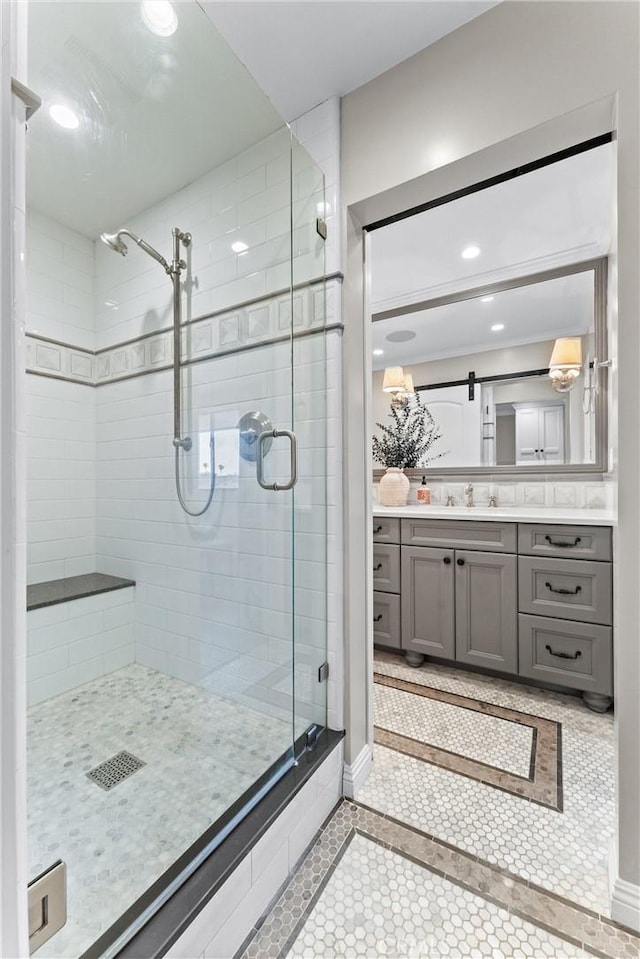 201 Bay Shore Ave Unit 305, Long Beach, CA 90803 - bathroom with inlaid floor details, a shower stall, vanity, recessed lighting, and tile patterned floors