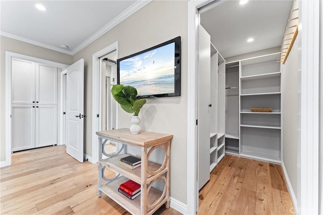 201 Bay Shore Ave Unit 305, Long Beach, CA 90803 - hallway featuring light wood-style floors, ornamental molding, and recessed lighting