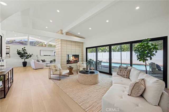 2414 Las Positas Rd, Glendale, CA 91208 - living area with high vaulted ceiling, beam ceiling, light wood-style flooring, a multi sided fireplace, and recessed lighting
