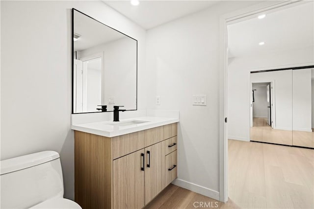 2414 Las Positas Rd, Glendale, CA 91208 - bathroom with vanity, wood finished floors, and recessed lighting