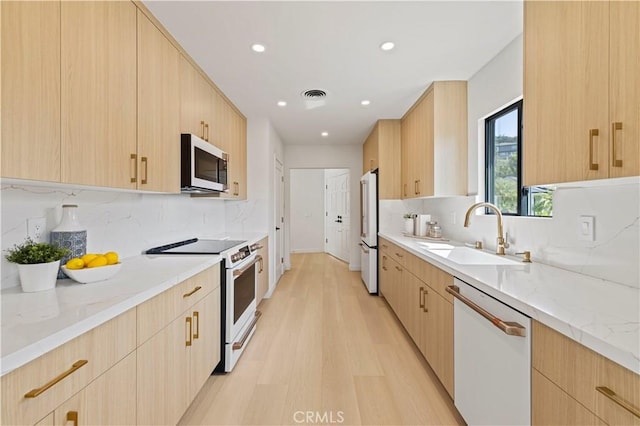 2414 Las Positas Rd, Glendale, CA 91208 - kitchen featuring white appliances, light brown cabinets, modern cabinets, and recessed lighting