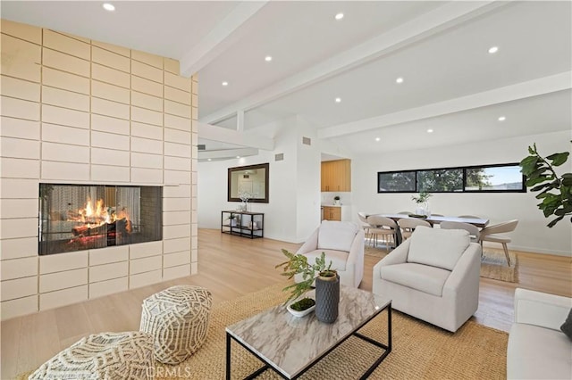2414 Las Positas Rd, Glendale, CA 91208 - living room featuring wood finished floors, recessed lighting, and a tile fireplace