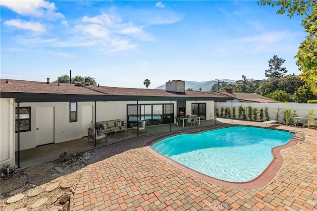 2414 Las Positas Rd, Glendale, CA 91208 - view of swimming pool with outdoor lounge area, a patio area, a fenced backyard, and a mountain view