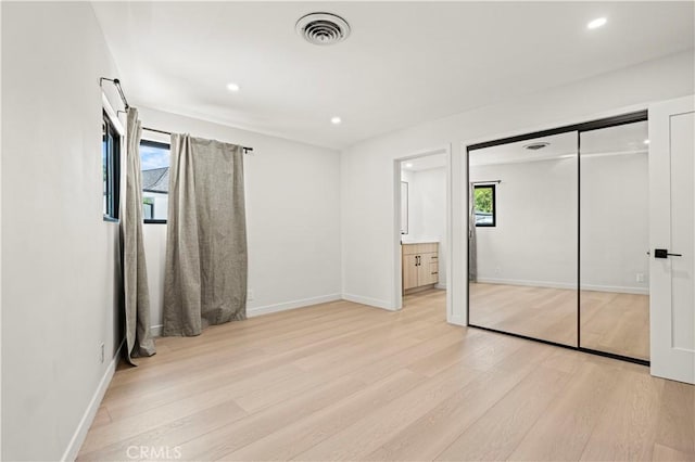 2414 Las Positas Rd, Glendale, CA 91208 - unfurnished bedroom with light wood-type flooring, recessed lighting, a closet, and connected bathroom
