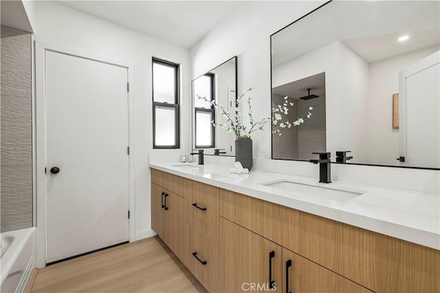 2414 Las Positas Rd, Glendale, CA 91208 - full bathroom with double vanity, a shower, wood finished floors, a tub, and recessed lighting
