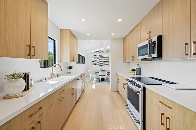 2414 Las Positas Rd, Glendale, CA 91208 - kitchen featuring appliances with stainless steel finishes, light brown cabinets, decorative backsplash, light countertops, and recessed lighting