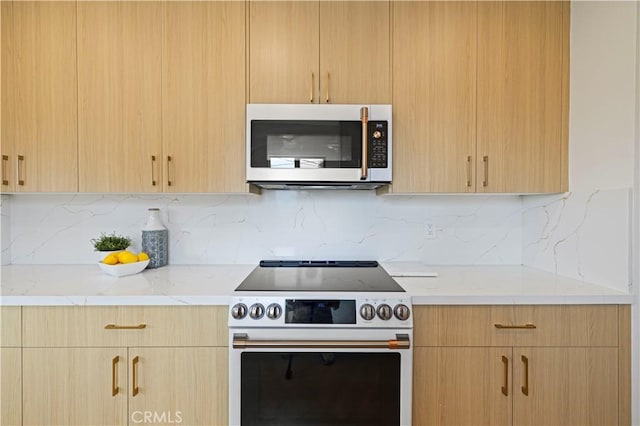 2414 Las Positas Rd, Glendale, CA 91208 - kitchen featuring stainless steel microwave, range with electric cooktop, and light brown cabinets