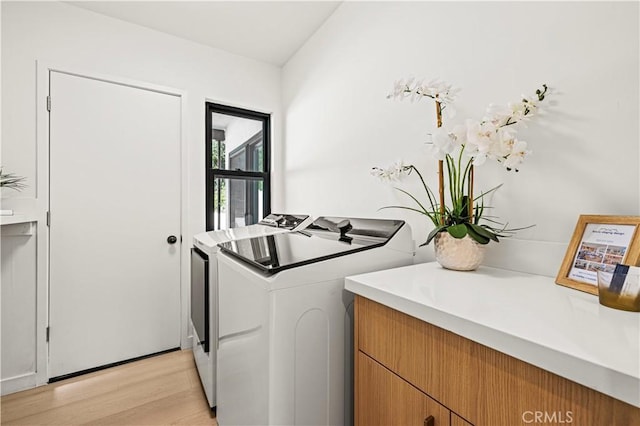 2414 Las Positas Rd, Glendale, CA 91208 - laundry room with washer and clothes dryer and light wood-style flooring