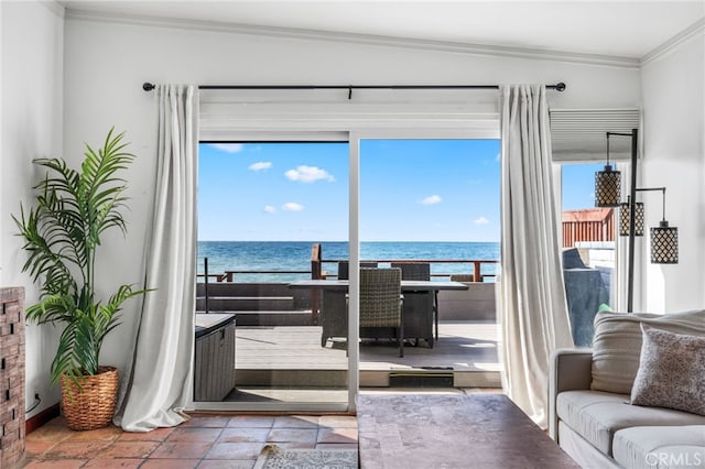 35171 Beach Rd, Dana Point, CA 92624 - living area featuring ornamental molding, a water view, and stone tile flooring