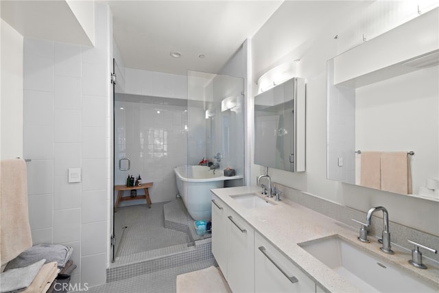 4151 Redwood Ave Unit 106, Los Angeles, CA 90066 - bathroom with tile patterned floors, a freestanding bath, double vanity, a shower stall, and tile walls