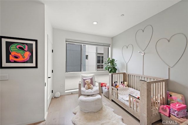 4151 Redwood Ave Unit 106, Los Angeles, CA 90066 - bedroom with wood finished floors, a nursery area, and recessed lighting