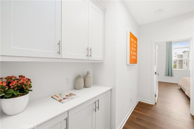 2256 Synergy, Irvine, CA 92614 - corridor featuring dark wood-style flooring and baseboards