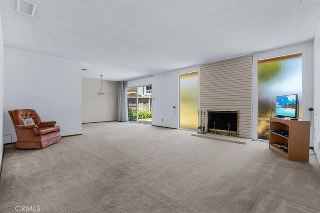 1283 W Newport St, San Luis Obispo, CA 93405 - unfurnished living room featuring a textured ceiling, carpet, and a brick fireplace