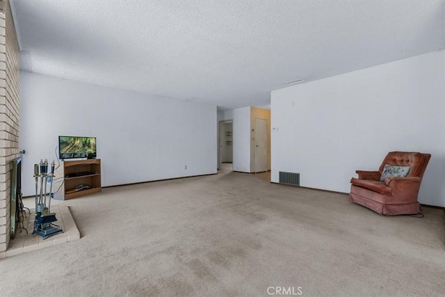 1283 W Newport St, San Luis Obispo, CA 93405 - unfurnished living room with a brick fireplace, carpet, and a textured ceiling