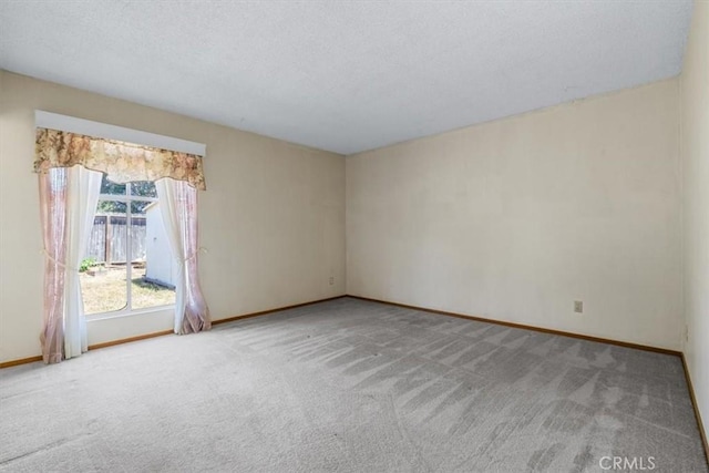 1283 W Newport St, San Luis Obispo, CA 93405 - carpeted spare room with baseboards and a textured ceiling