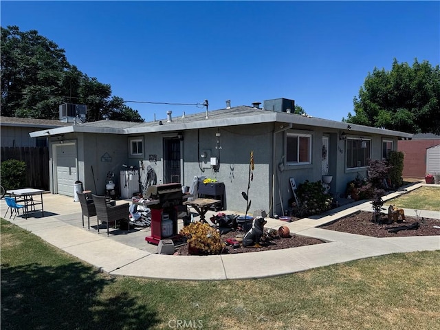 1140 Front St, Livingston, CA 95334 - back of property featuring stucco siding and a garage