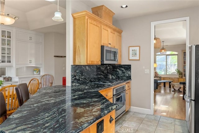 17 Arminta Ct, Chico, CA 95928 - kitchen featuring stainless steel appliances, backsplash, dark stone counters, recessed lighting, and light tile patterned floors
