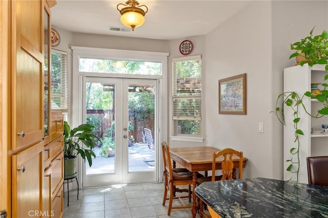 17 Arminta Ct, Chico, CA 95928 - dining space with french doors and light tile patterned flooring